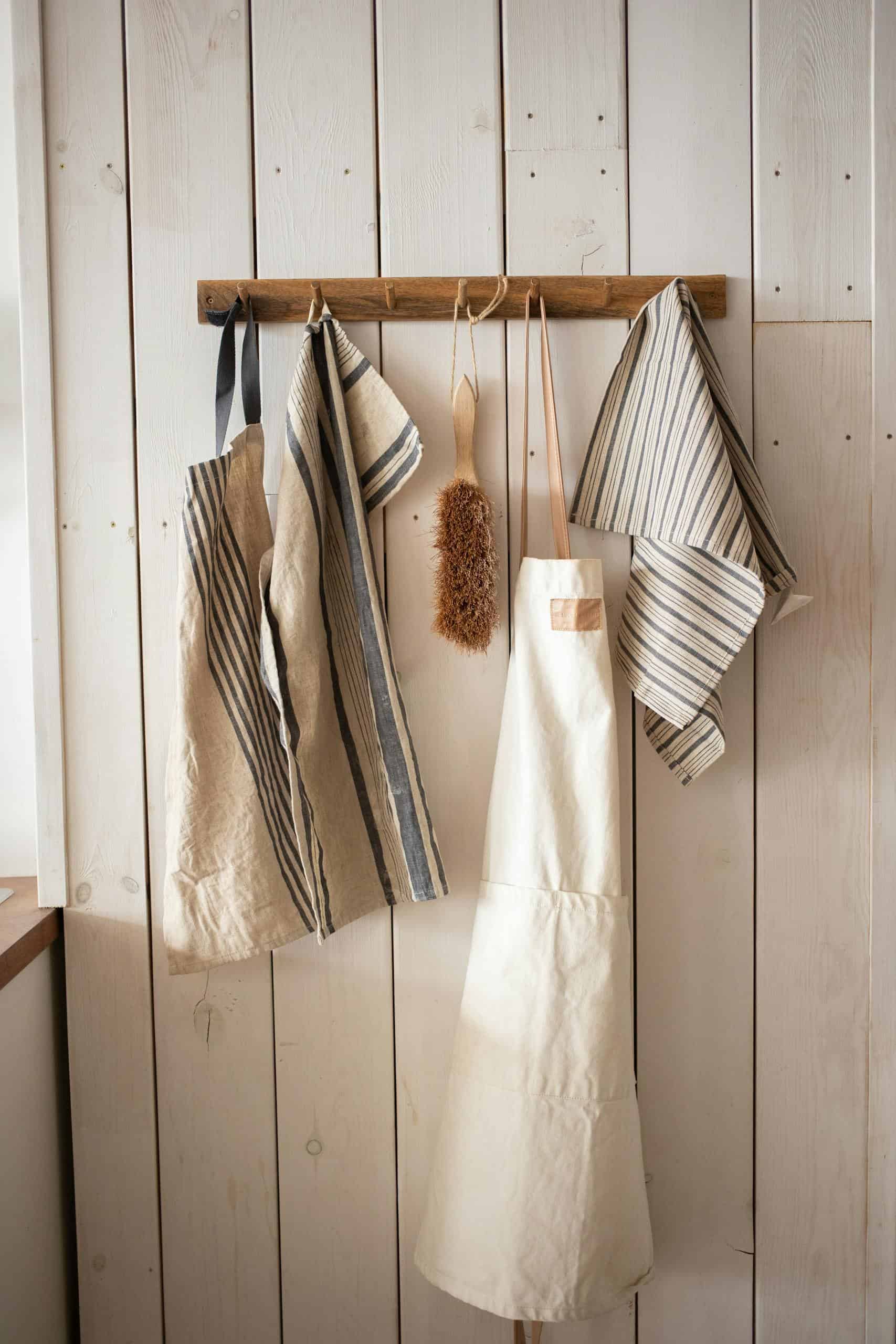 White Apron Hanging on the Wall living slower at home